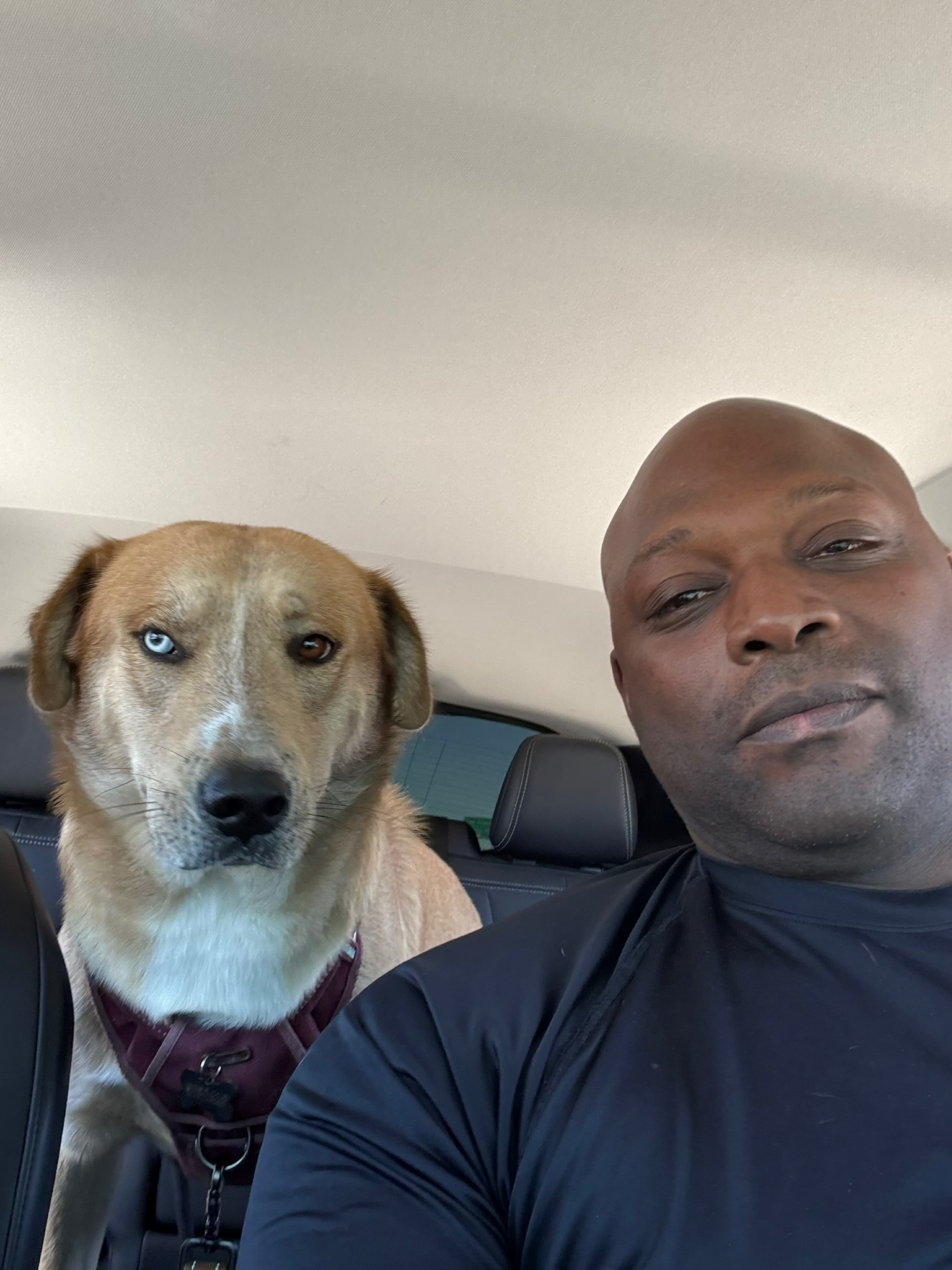Dario and Uncle Ruckus sitting together in a car